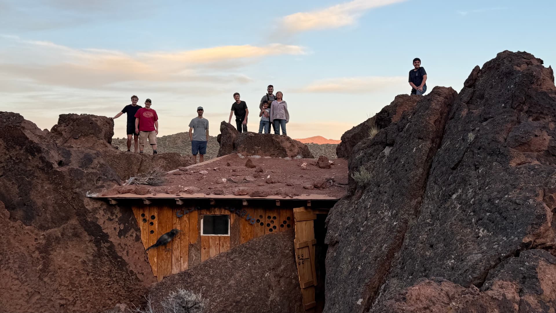 Ward members exploring a historic desert cabin